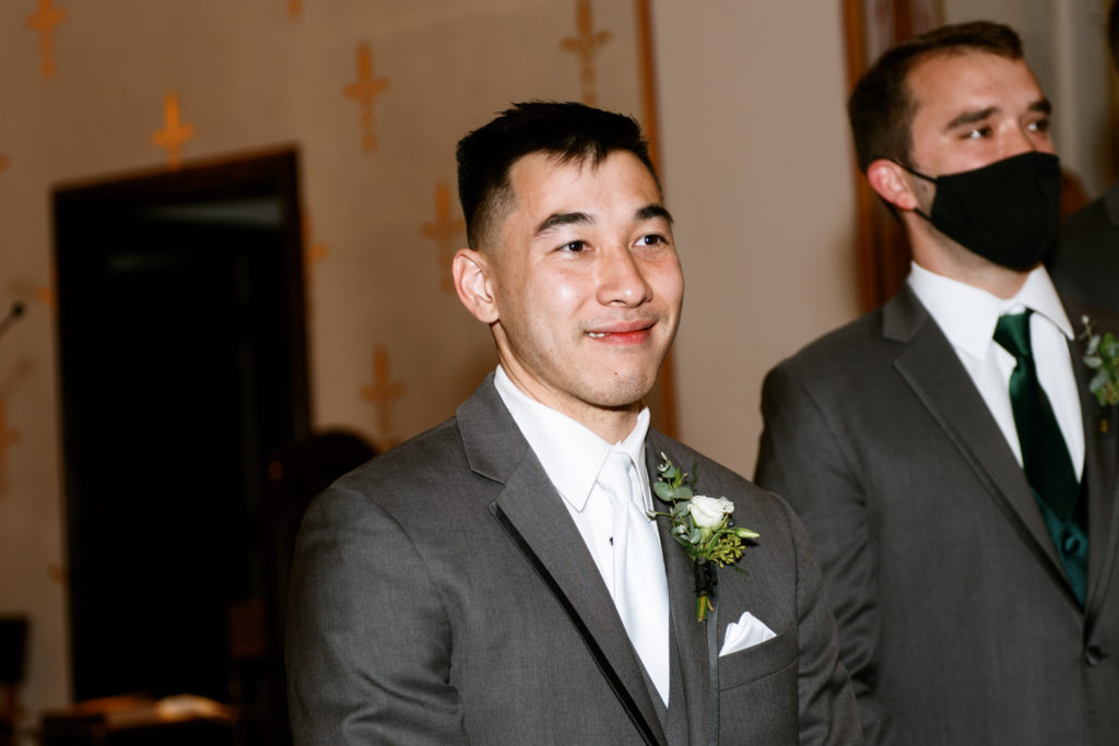 Groom at wedding ceremony at St. John Paul II in St. Louis