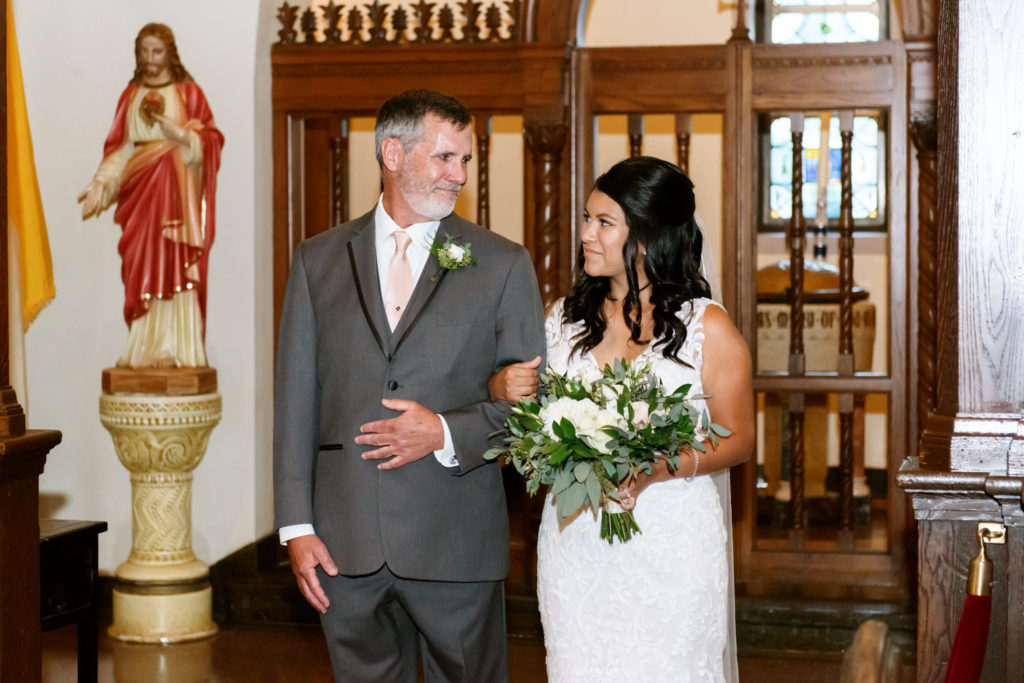 Father and bride at wedding ceremony at St. John Paul II in St. Louis