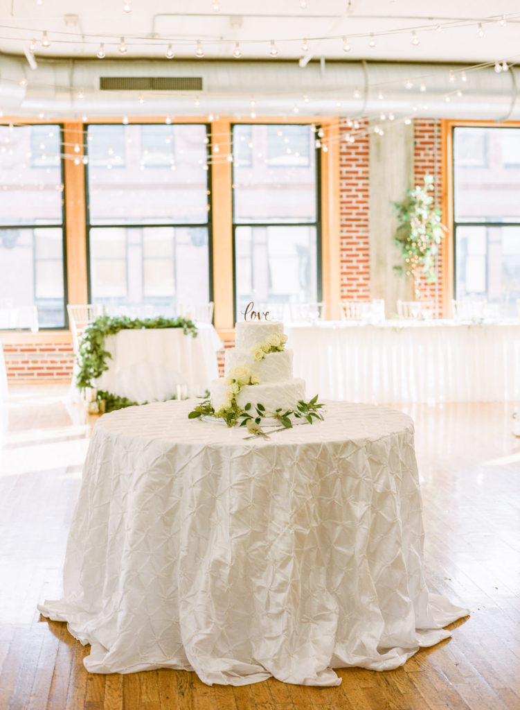 White wedding cake at St. Louis wedding venue Windows on Washington; St. Louis wedding photographer