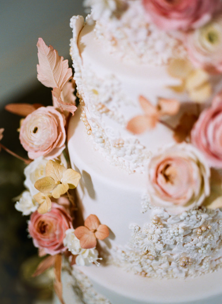 Pink and peach floral wedding cake; St. Louis wedding photographer