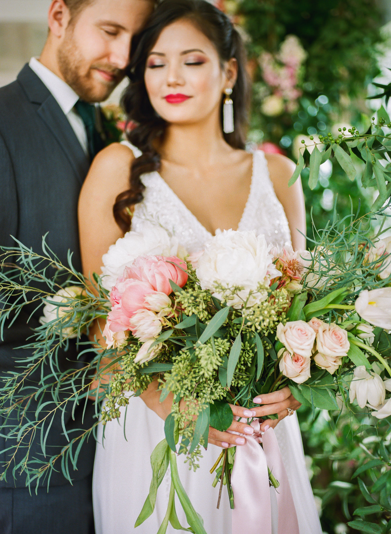 Pink floral bouquet and bride and groom; St. Louis wedding photographer Erica Robnett Photography