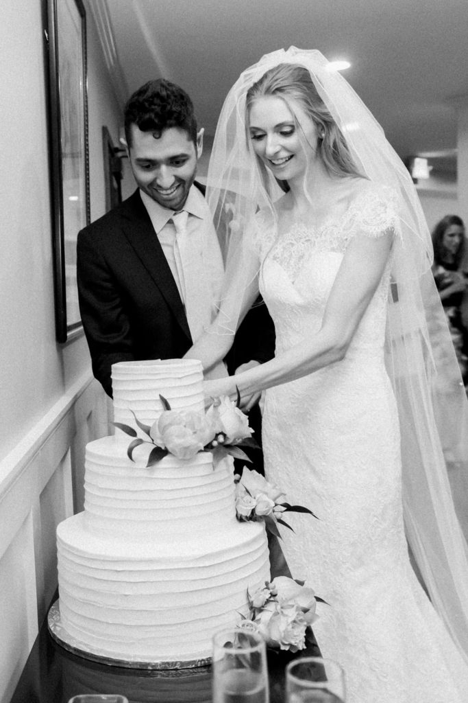 Bride and groom cake cut; St. Louis wedding photographer